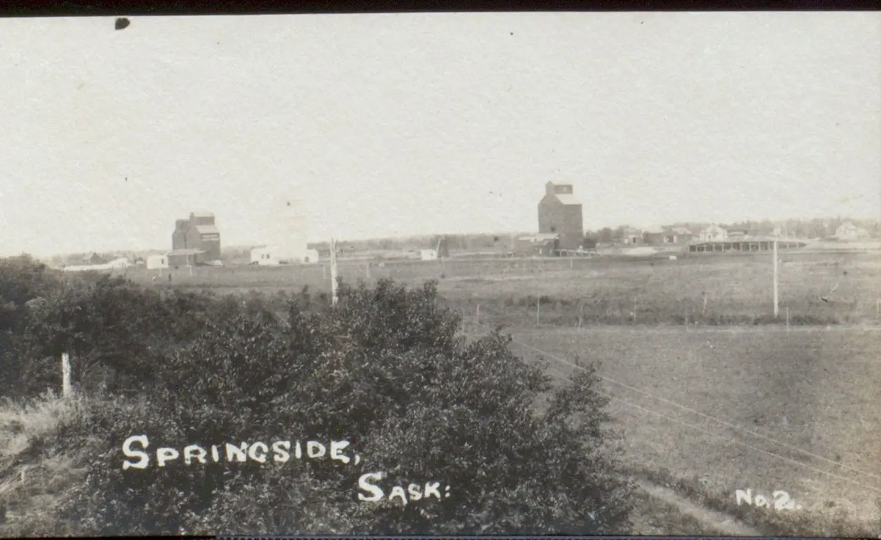 View of Springside with grain elevators, about 1910